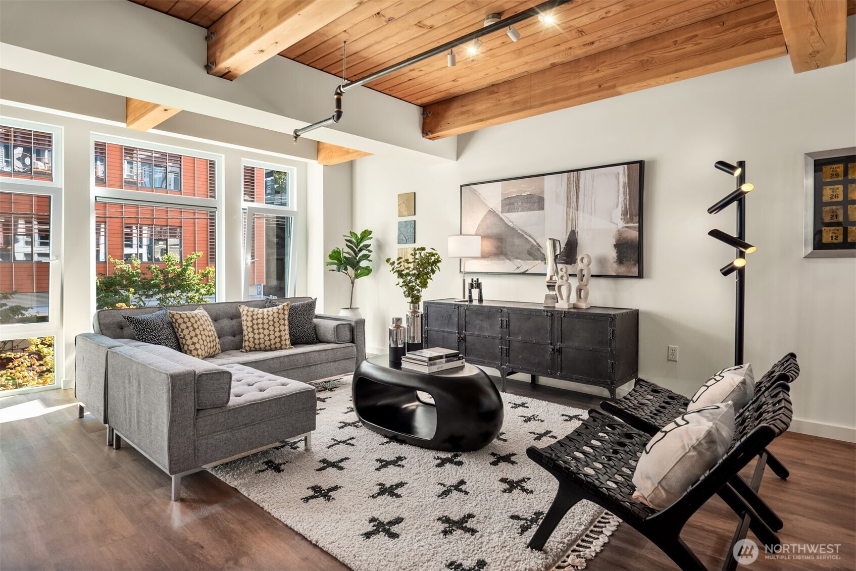 401 9th Avenue North, Unit 210 Seattle, WA 98109 - Photo 22 of 30 a living room with furniture a rug and a potted plant
