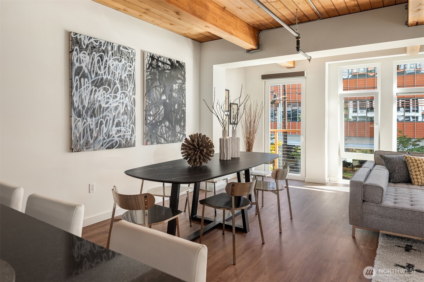 401 9th Avenue North, Unit 210 Seattle, WA 98109 - Photo 23 of 30 a view of a dining room with furniture and wooden floor
