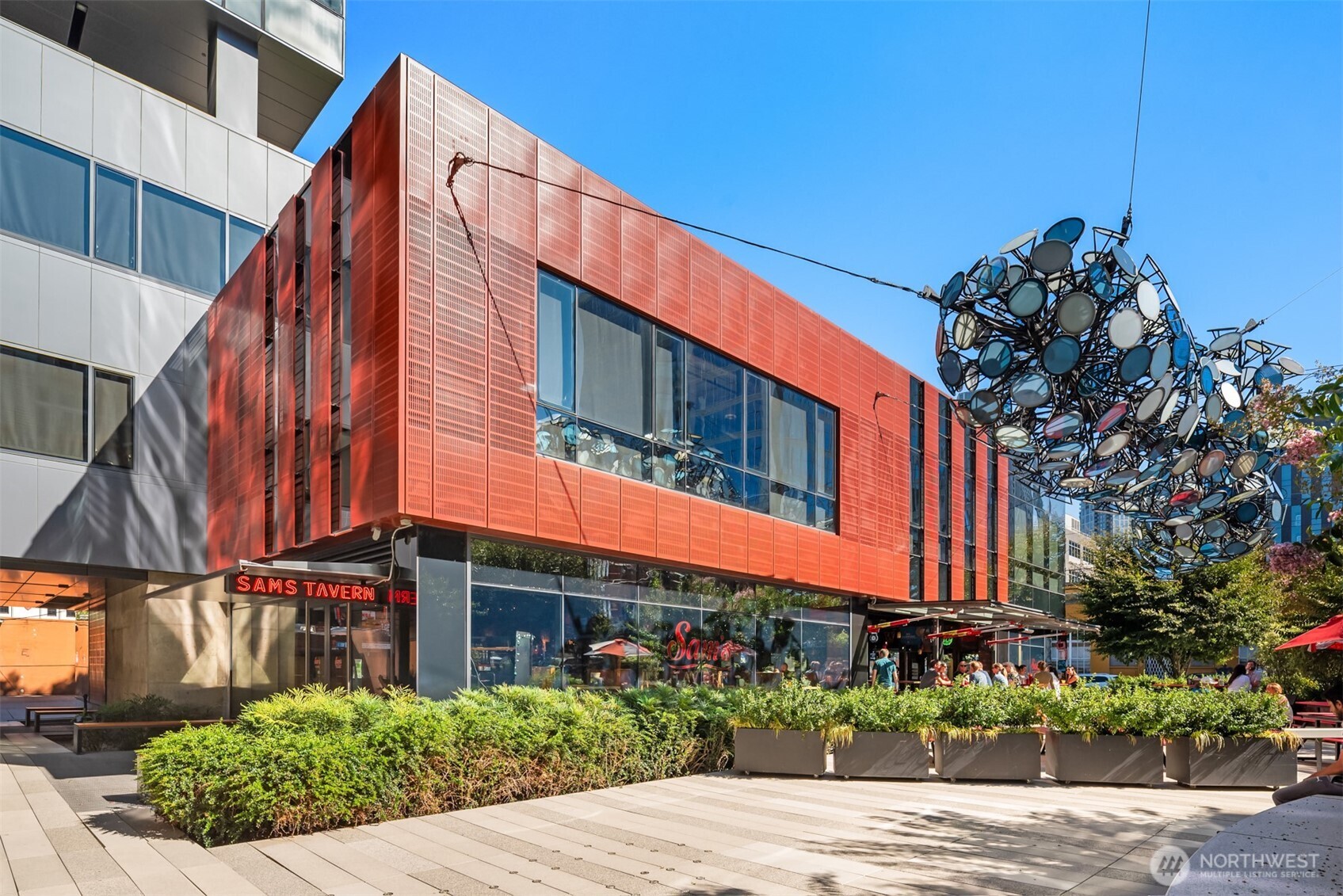 401 9th Avenue North, Unit 210 Seattle, WA 98109 - Photo 25 of 30 a view of a house with a small yard and potted plants
