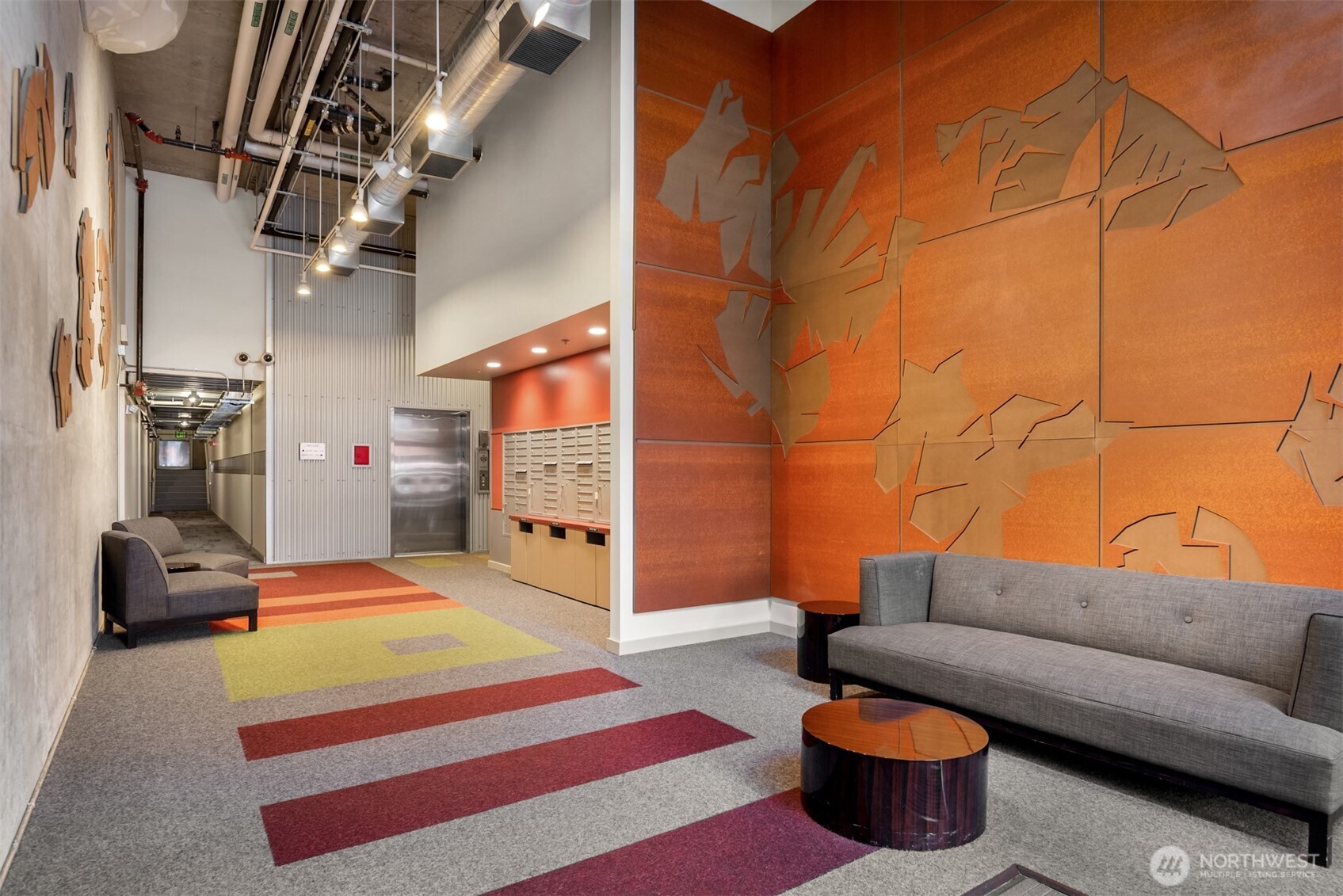 401 9th Avenue North, Unit 210 Seattle, WA 98109 - Photo 3 of 30 a living room with furniture and a rug