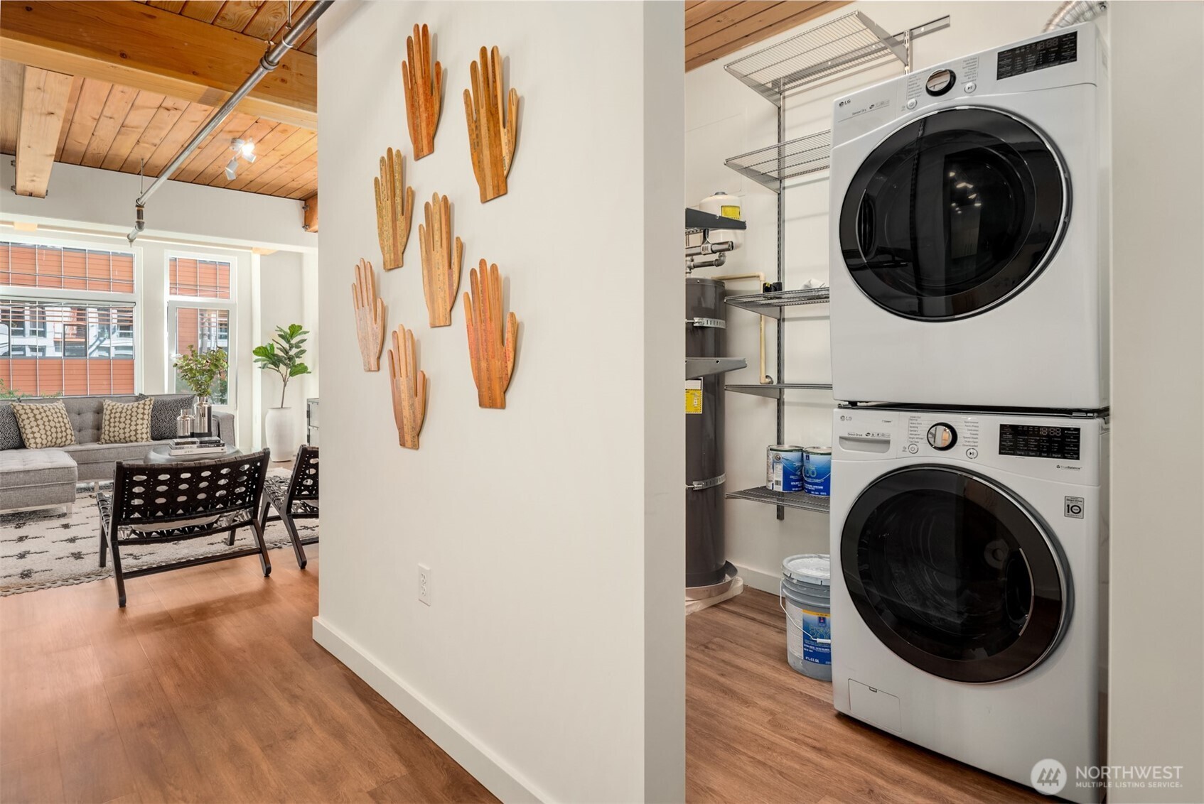 401 9th Avenue North, Unit 210 Seattle, WA 98109 - Photo 9 of 30 a view of a hallway with washer and dryer