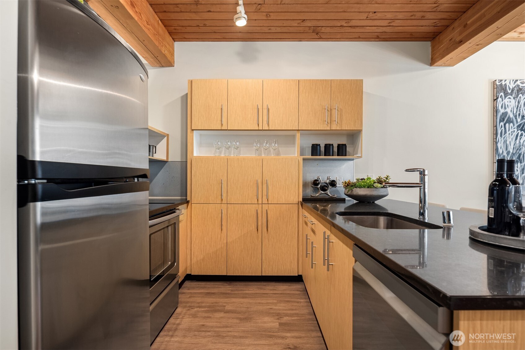 401 9th Avenue North, Unit 210 Seattle, WA 98109 - Photo 10 of 30 a kitchen with a sink and cabinets