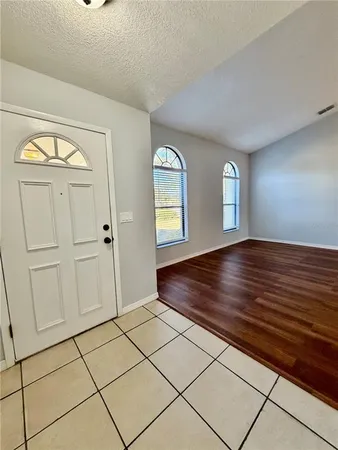 a view of an empty room and window