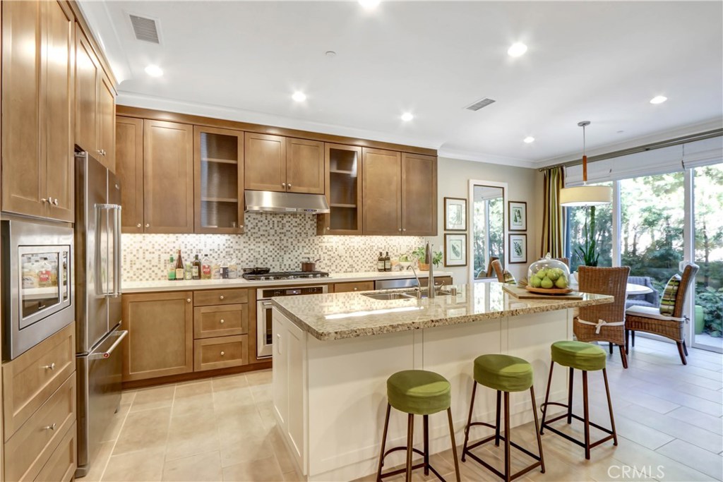 106 Working Ranch Irvine, CA 92602 - Photo 1 of 1 a large kitchen with granite countertop lots of counter space and windows