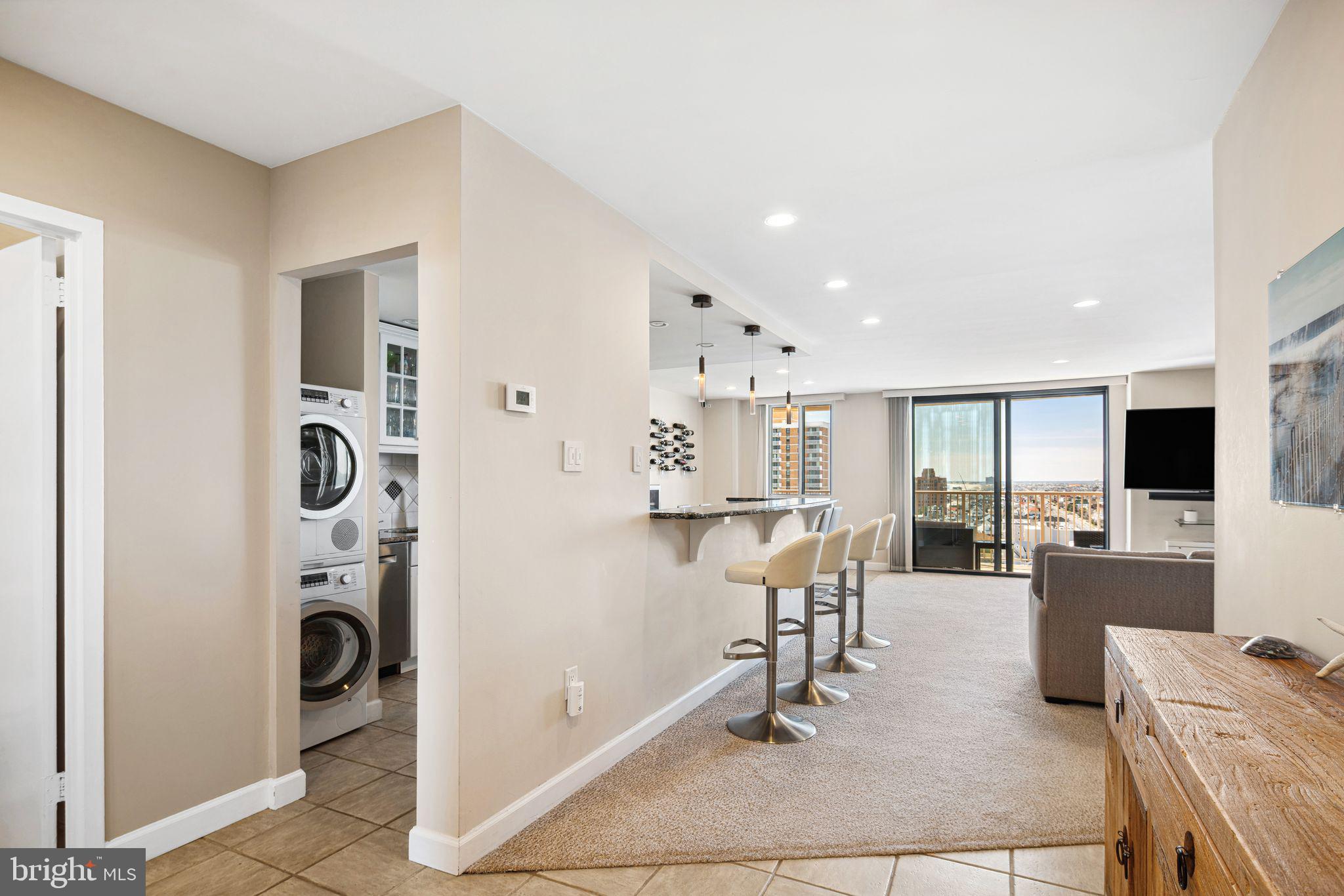 5000 Boardwalk Ventnor City, NJ 08406 - Photo 13 of 44 a view of a livingroom with furniture and a flat screen tv