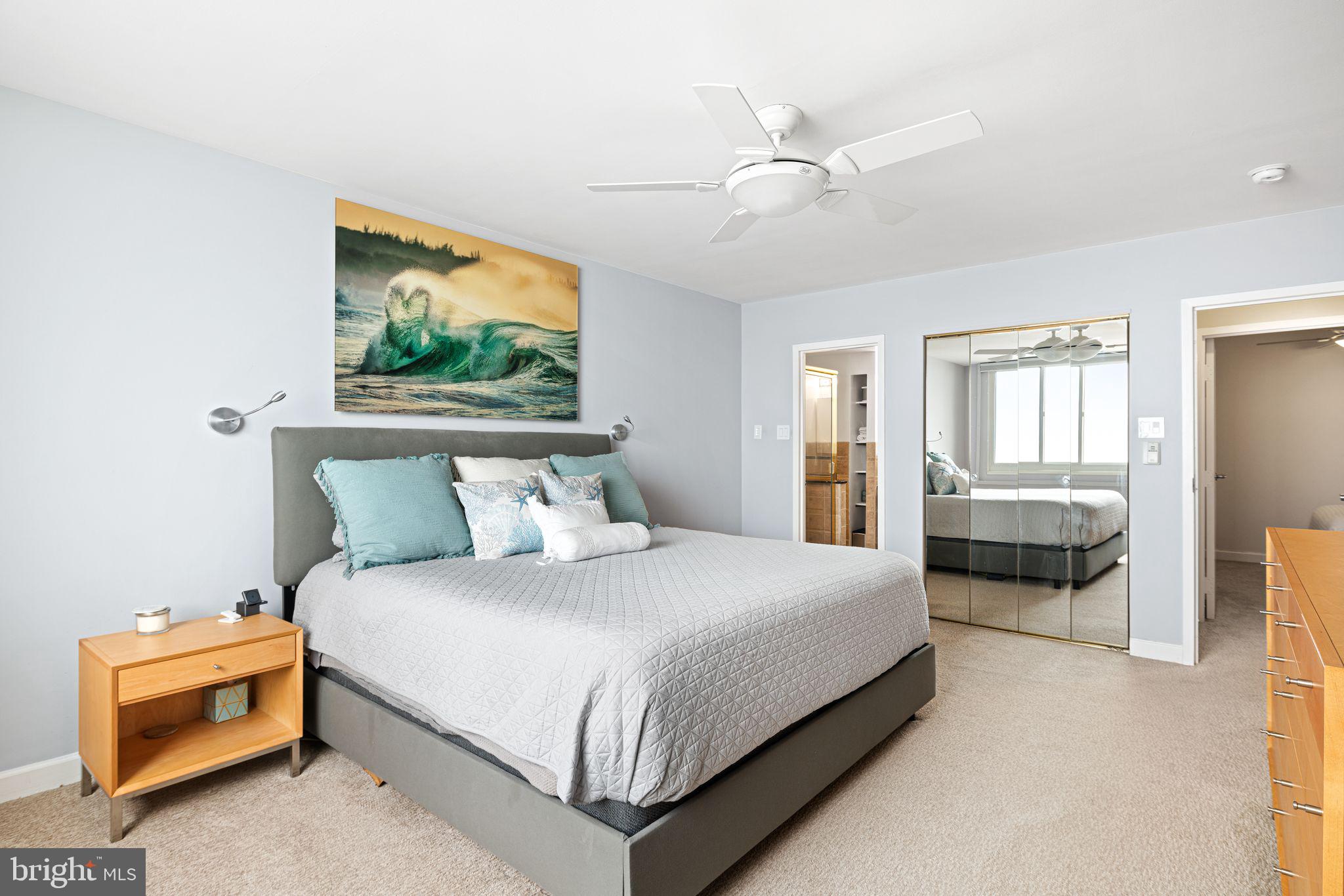 5000 Boardwalk Ventnor City, NJ 08406 - Photo 18 of 44 a bedroom with a bed and a painting on the wall