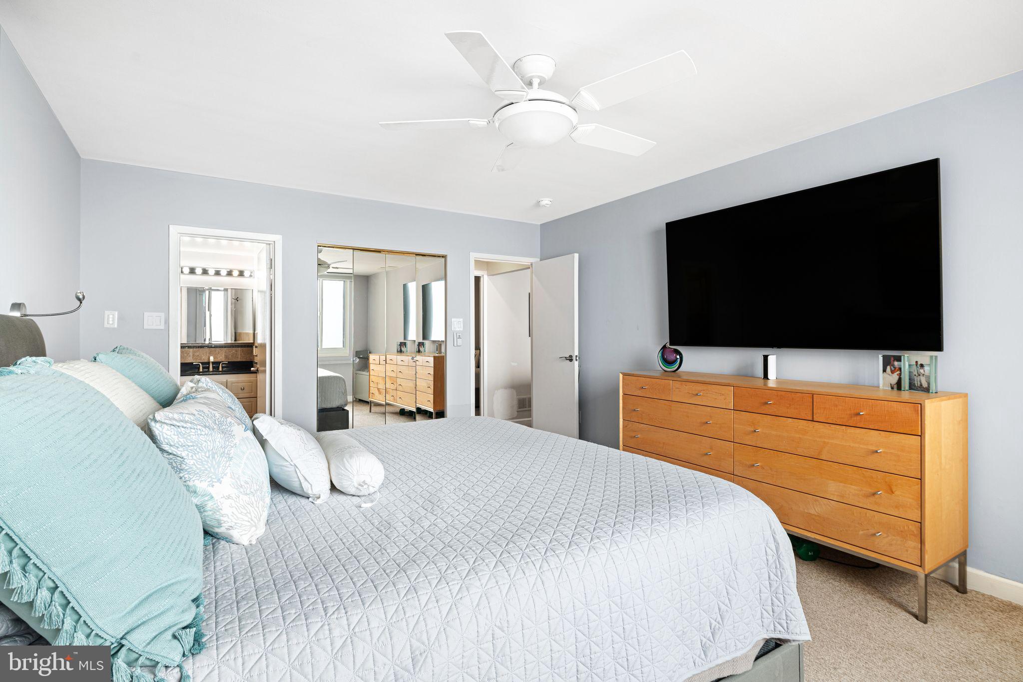 5000 Boardwalk Ventnor City, NJ 08406 - Photo 21 of 44 a bedroom with a bed and a flat screen tv