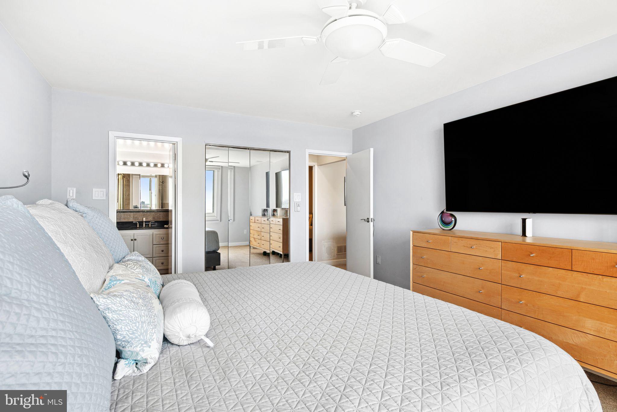 5000 Boardwalk Ventnor City, NJ 08406 - Photo 22 of 44 a bedroom with a bed and a flat screen tv