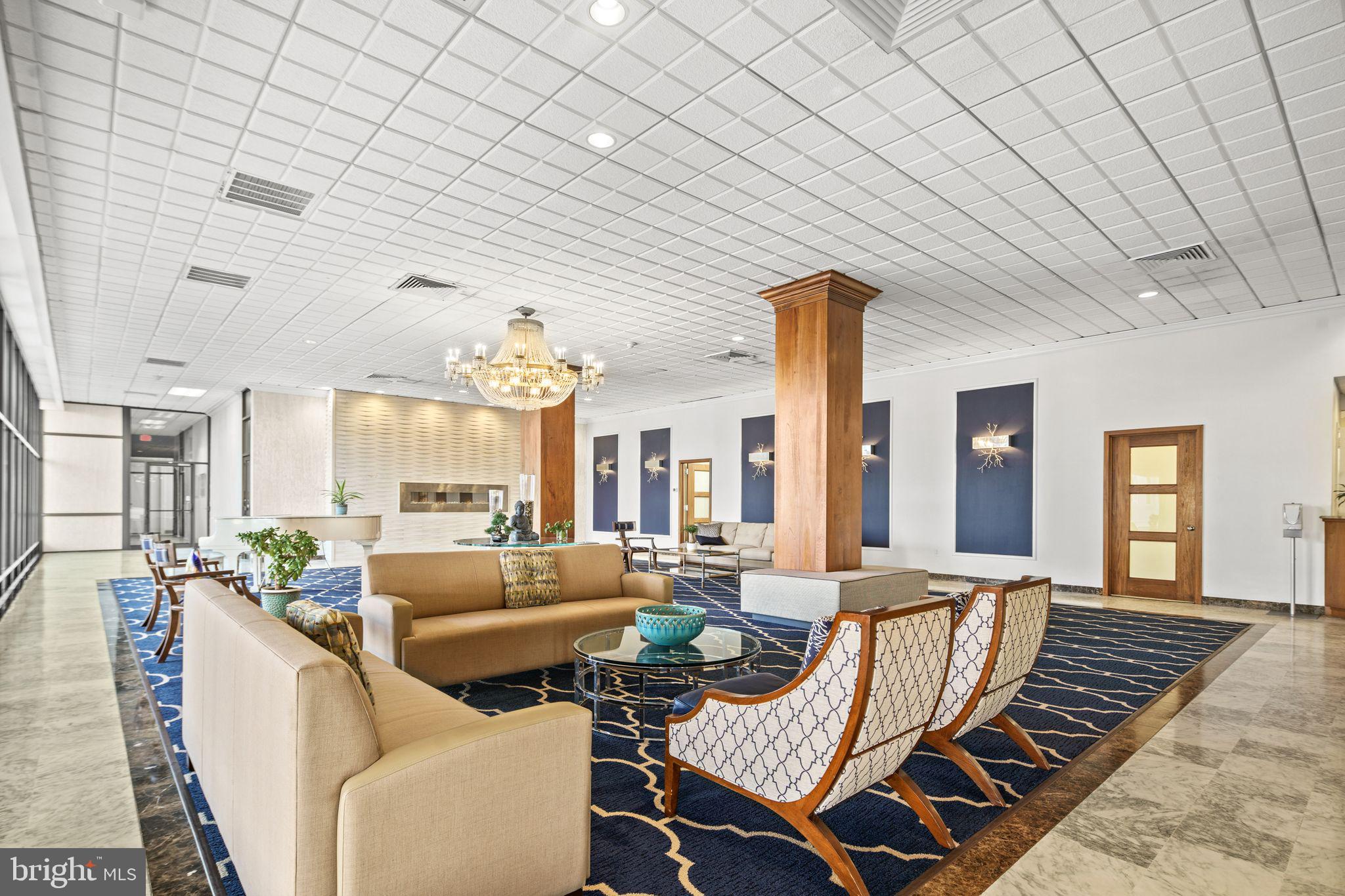 5000 Boardwalk Ventnor City, NJ 08406 - Photo 36 of 44 a living room with furniture and a chandelier