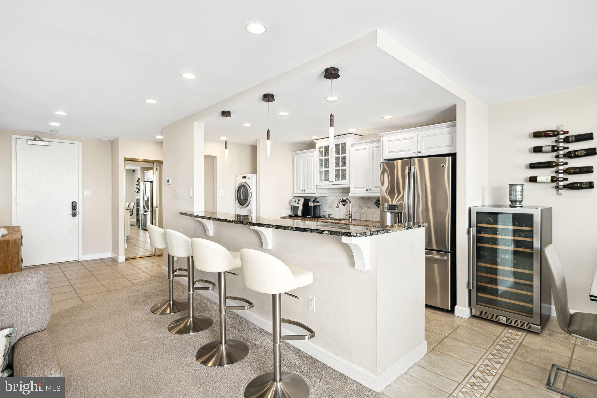 5000 Boardwalk Ventnor City, NJ 08406 - Photo 9 of 44 a large kitchen with a table and chairs