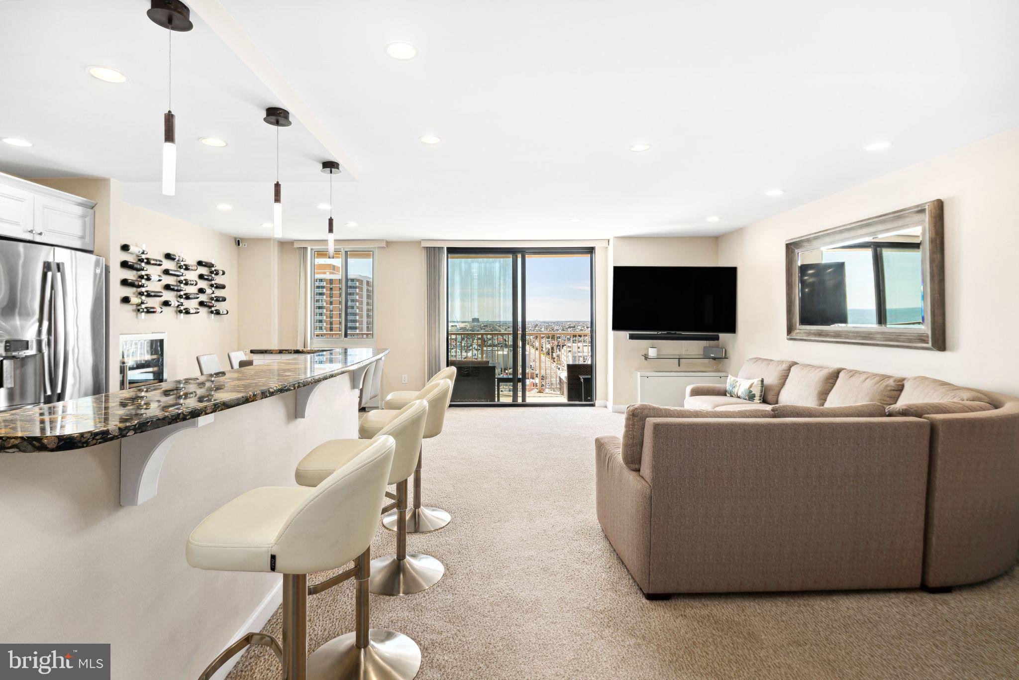 5000 Boardwalk Ventnor City, NJ 08406 - Photo 10 of 44 a living room with furniture and a flat screen tv