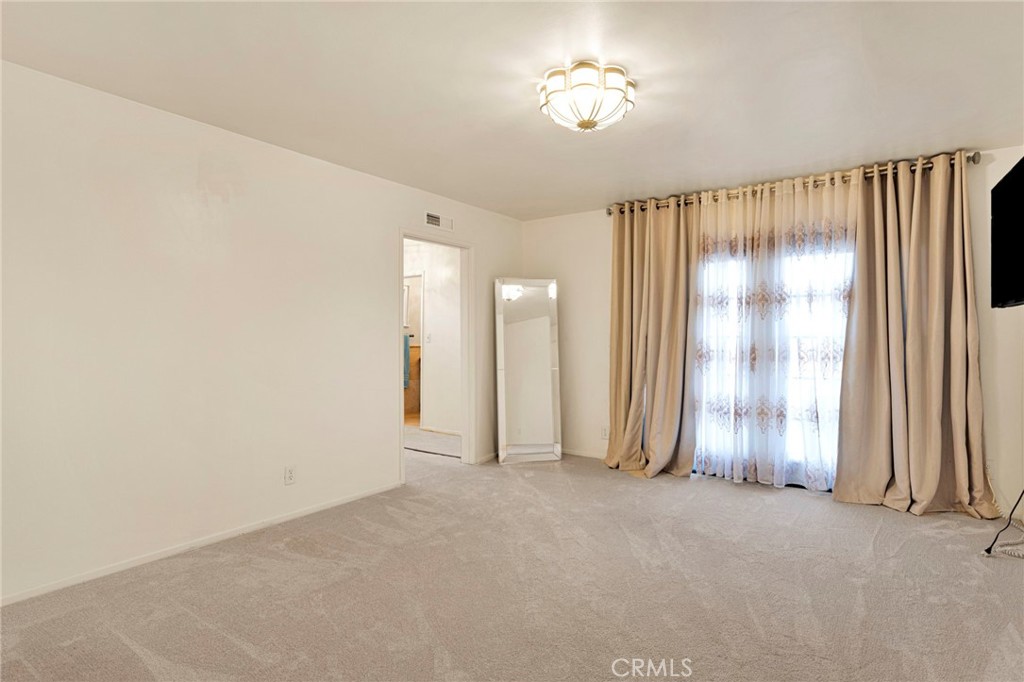 15177 Mendota Road North Apple Valley, CA 92307 - Photo 13 of 50 a view of empty room with a ceiling fan