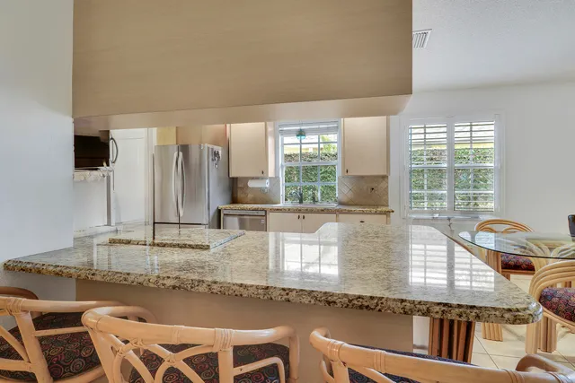 a view of a storage and utility room with closet dryer and washer