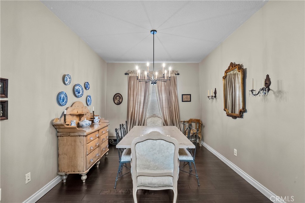 28409 Connick Place Saugus, CA 91350 - Photo 23 of 66 a dining room with furniture and chandelier