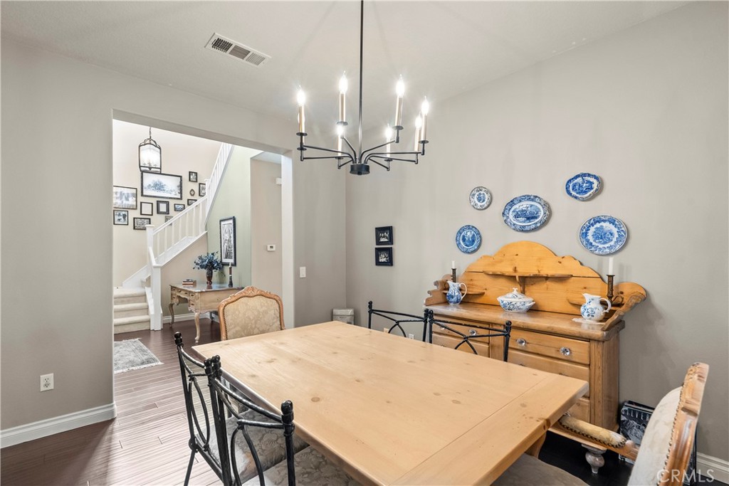 28409 Connick Place Saugus, CA 91350 - Photo 25 of 66 a view of a dining room with furniture and a chandelier