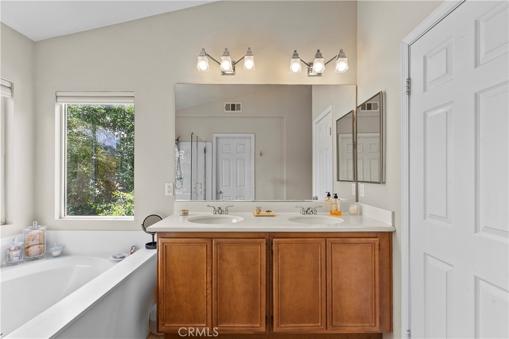 28409 Connick Place Saugus, CA 91350 - Photo 35 of 66 a bathroom with a double vanity sink mirror and double