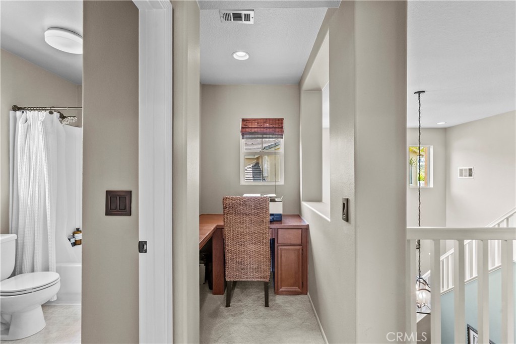 28409 Connick Place Saugus, CA 91350 - Photo 41 of 66 a view of a hallway with bathroom and wooden floor