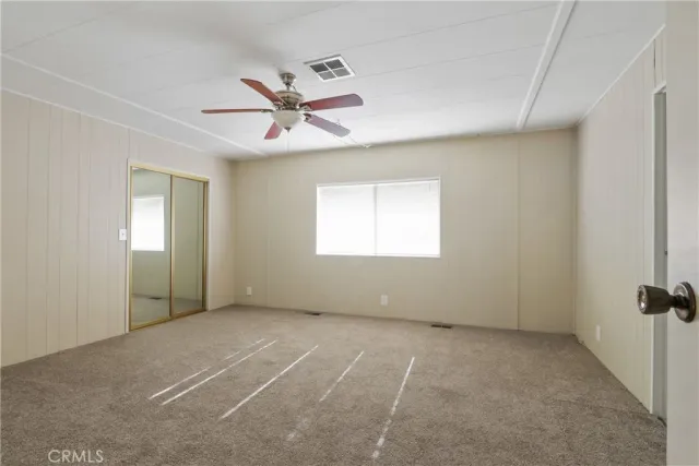 a spacious bathroom with a double vanity sink large mirror and a bathtub