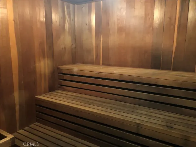 a room with pool table and windows