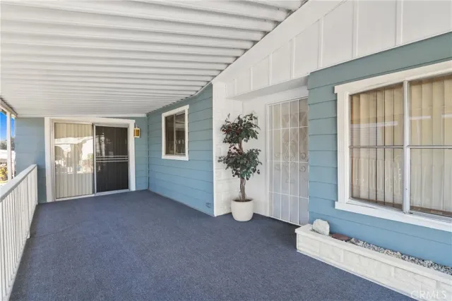 a view of a livingroom with an empty space and wooden floor