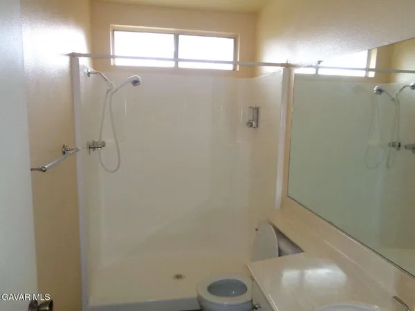 a bathroom with a sink and a large mirror