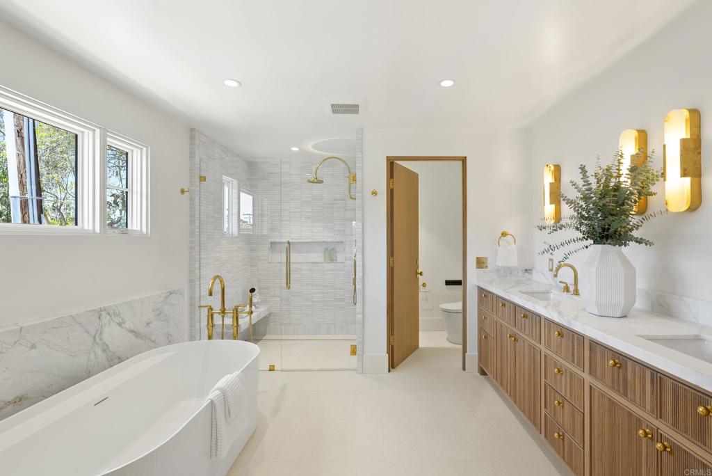 5927 Linea Del Cielo, Unit ELM Rancho Santa Fe, CA 92067 - Photo 11 of 20 a bathroom with a tub sink and mirror