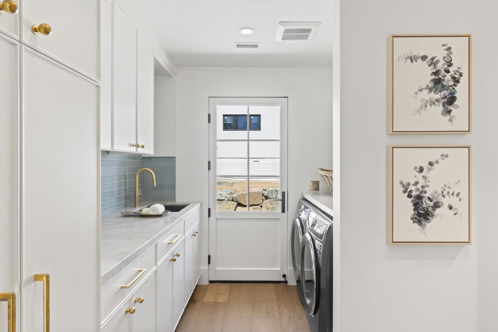 5927 Linea Del Cielo, Unit ELM Rancho Santa Fe, CA 92067 - Photo 15 of 20 a kitchen with a refrigerator and a sink
