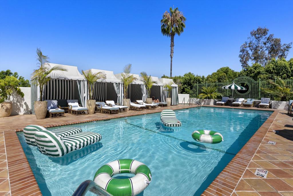 5927 Linea Del Cielo, Unit ELM Rancho Santa Fe, CA 92067 - Photo 17 of 20 a view of a swimming pool with chairs