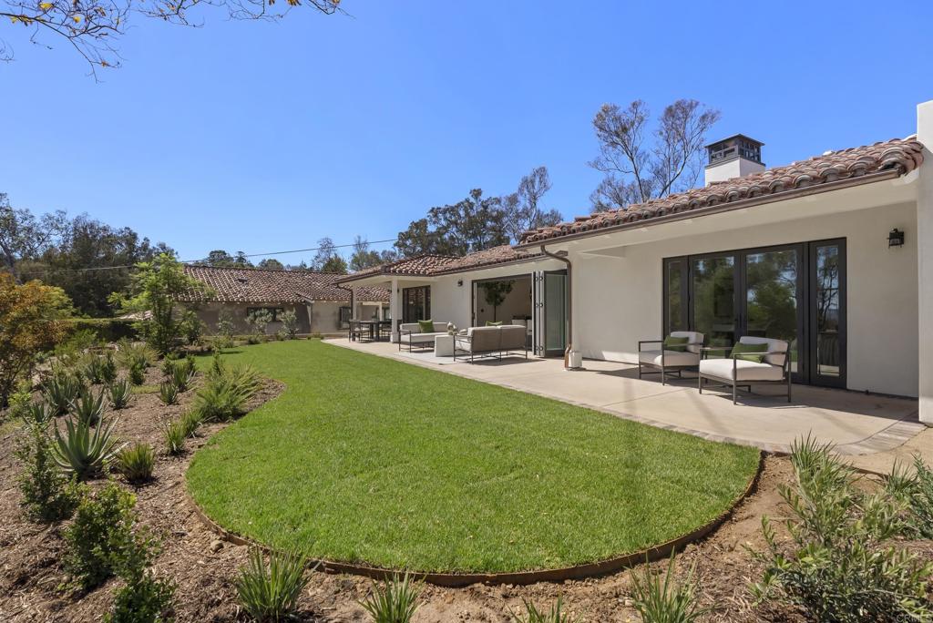 5927 Linea Del Cielo, Unit ELM Rancho Santa Fe, CA 92067 - Photo 19 of 20 a view of a house with swimming pool and furniture