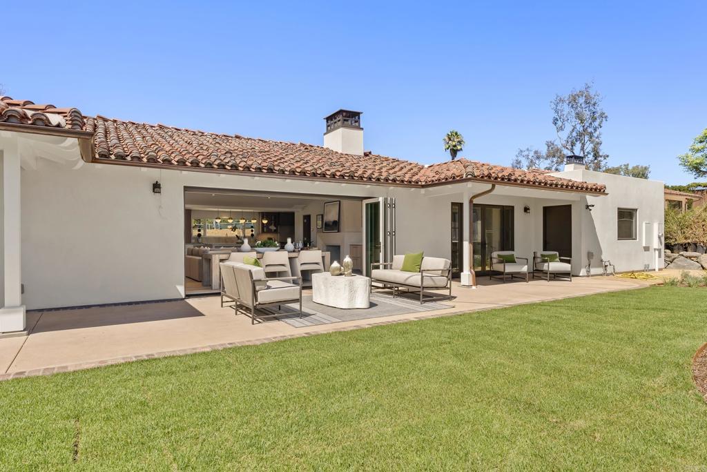 5927 Linea Del Cielo, Unit ELM Rancho Santa Fe, CA 92067 - Photo 20 of 20 a view of a house with backyard porch and sitting area