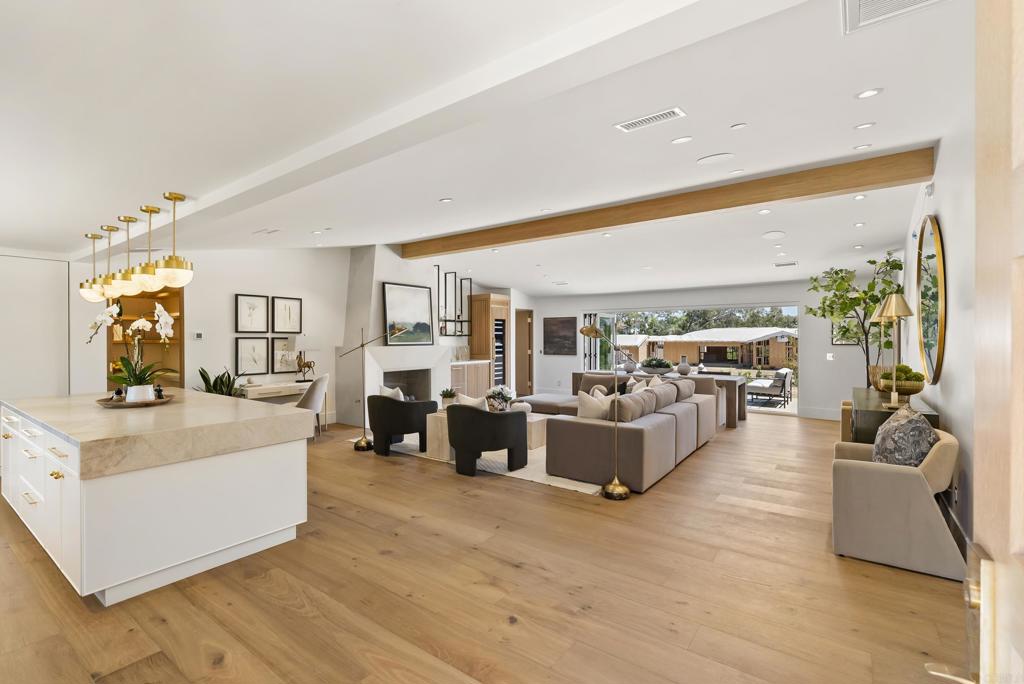 5927 Linea Del Cielo, Unit ELM Rancho Santa Fe, CA 92067 - Photo 5 of 20 a living room with furniture and a large window