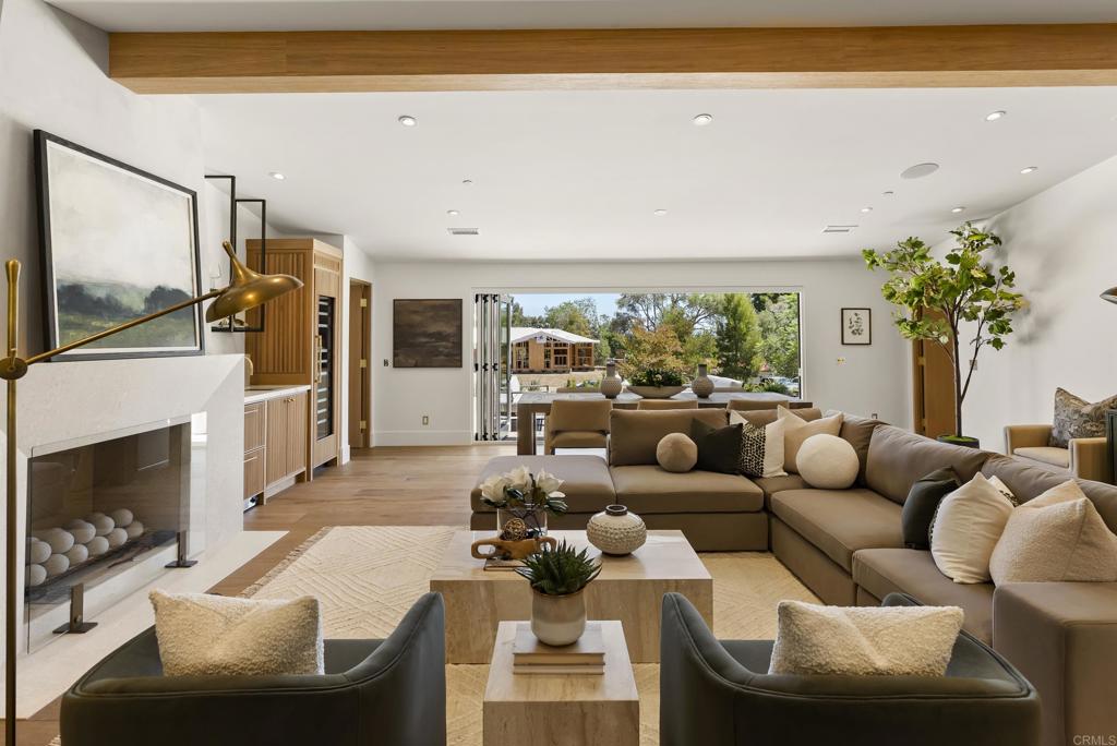 5927 Linea Del Cielo, Unit ELM Rancho Santa Fe, CA 92067 - Photo 6 of 20 a living room with furniture fireplace and flat screen tv