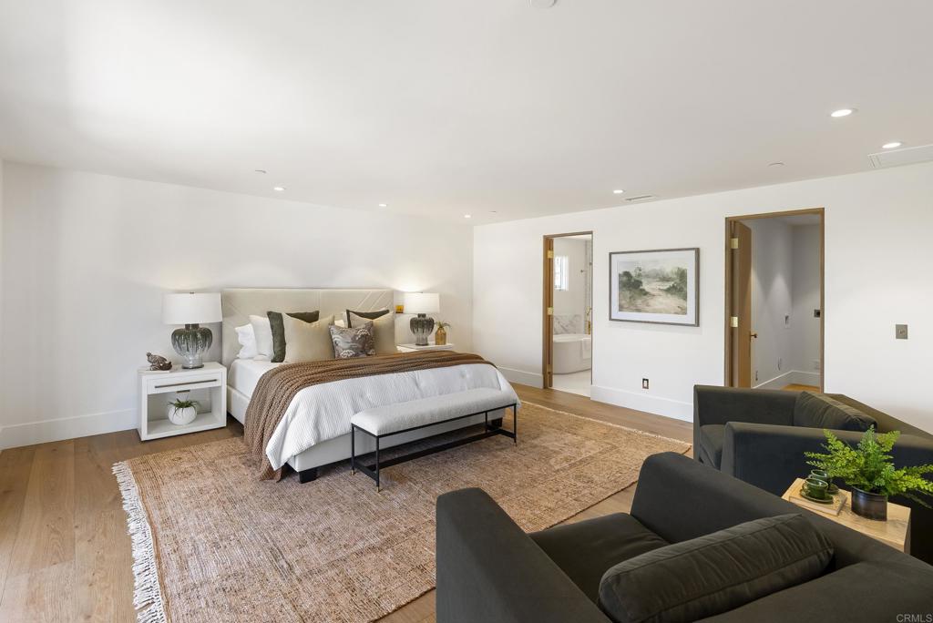 5927 Linea Del Cielo, Unit ELM Rancho Santa Fe, CA 92067 - Photo 9 of 20 a bedroom with a bed couch and window