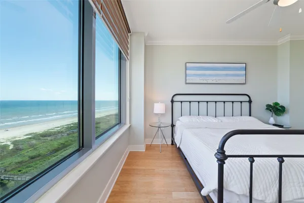 a bed sitting in a balcony next to a yard