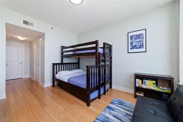 a bedroom with a bed and a couch