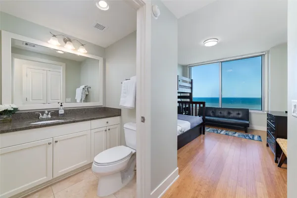 a bathroom with a toilet a sink and a bathtub