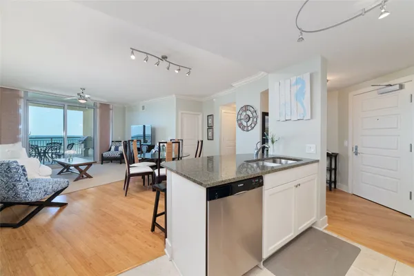 a living room with furniture a dining table and chairs
