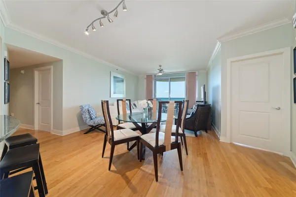 a view of a dining room with furniture and wooden floor