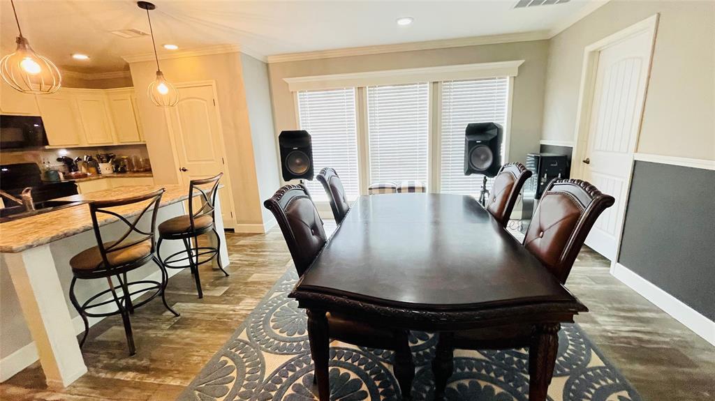 8394 Lake Road Mansfield, TX 76063 - Photo 5 of 22 a view of a dining room with furniture and window