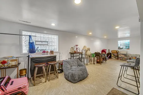 a bathroom with a sink mirror and toilet