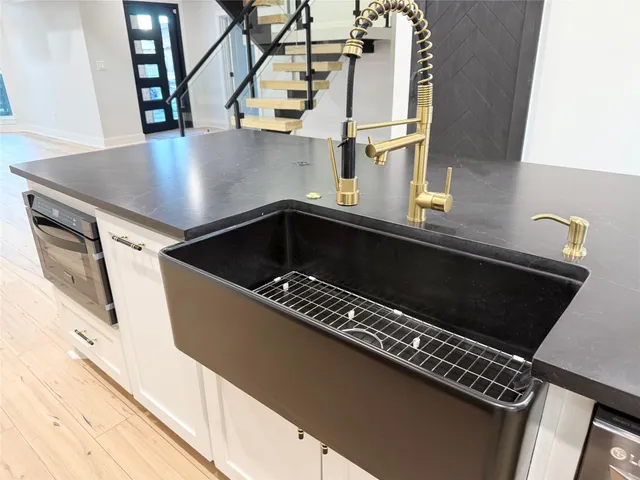 a kitchen with a sink and cabinets