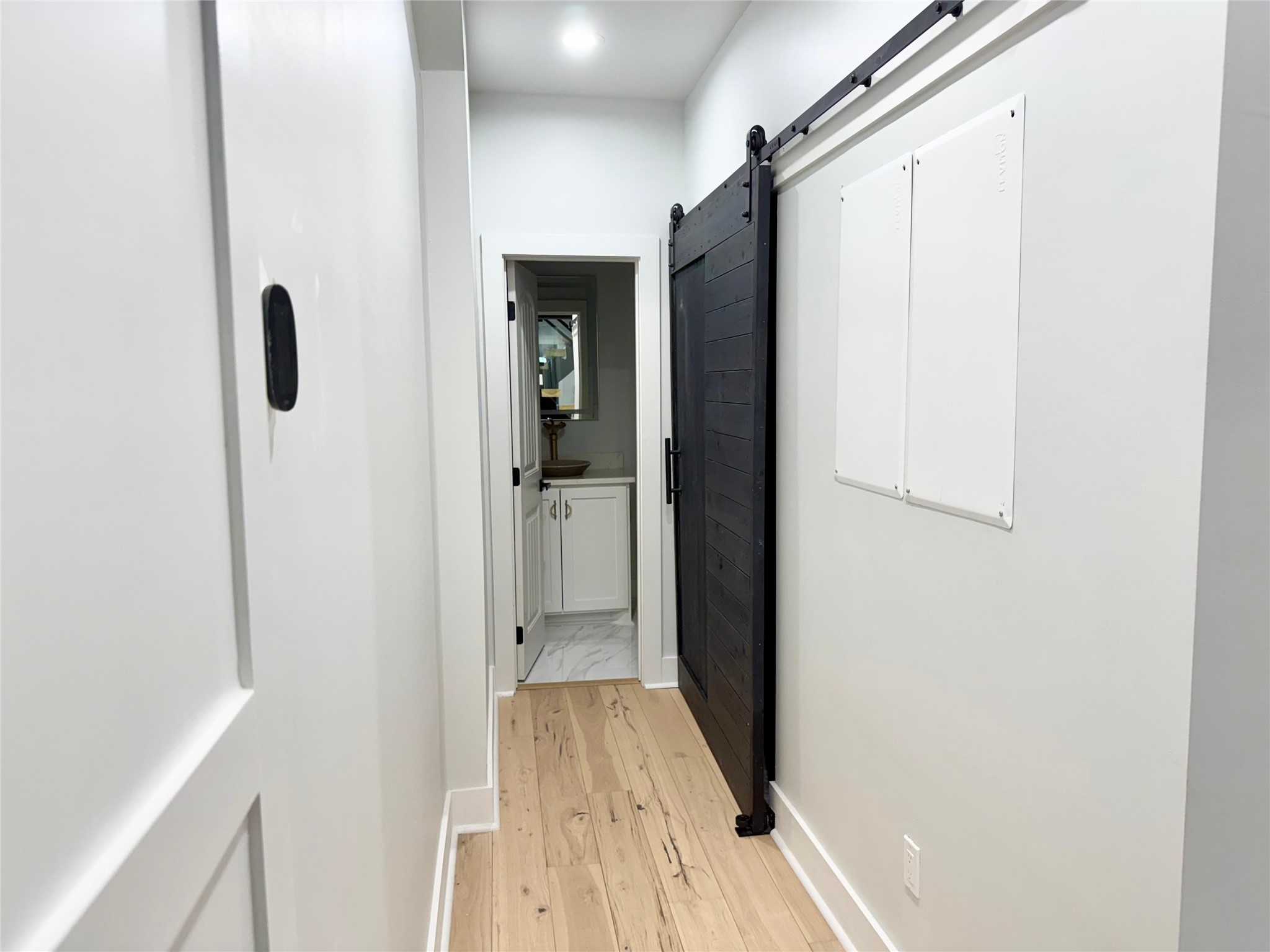 1617 Common Street Houston, TX 77009 - Photo 13 of 50 a view of a hallway with wooden floor and staircase