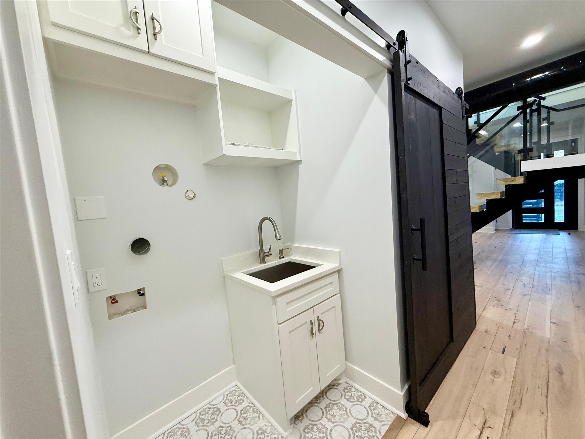 1617 Common Street Houston, TX 77009 - Photo 14 of 50 a kitchen with a sink and cabinets