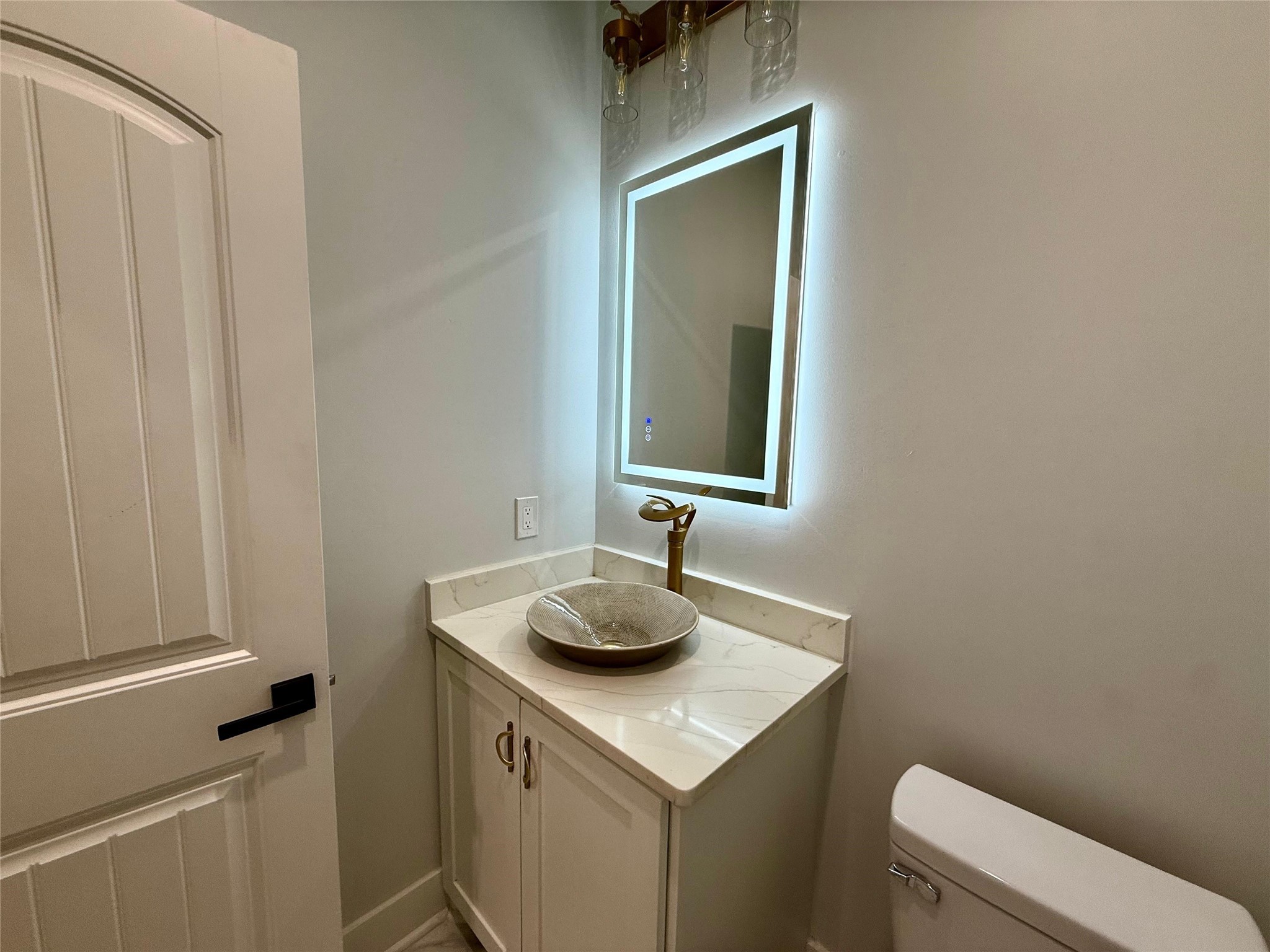 1617 Common Street Houston, TX 77009 - Photo 15 of 50 a bathroom with a toilet sink and vanity