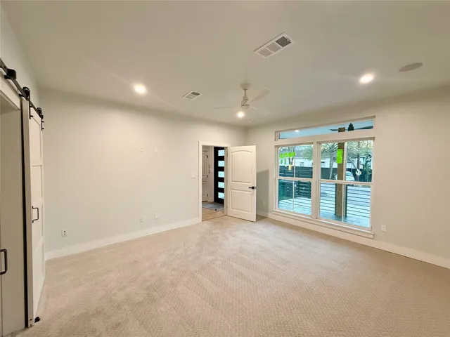 a spacious bathroom with a granite countertop sink and mirror