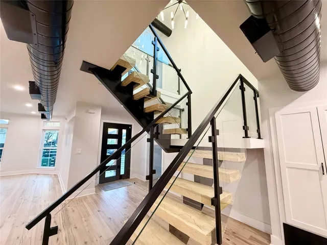a view of a hallway with furniture