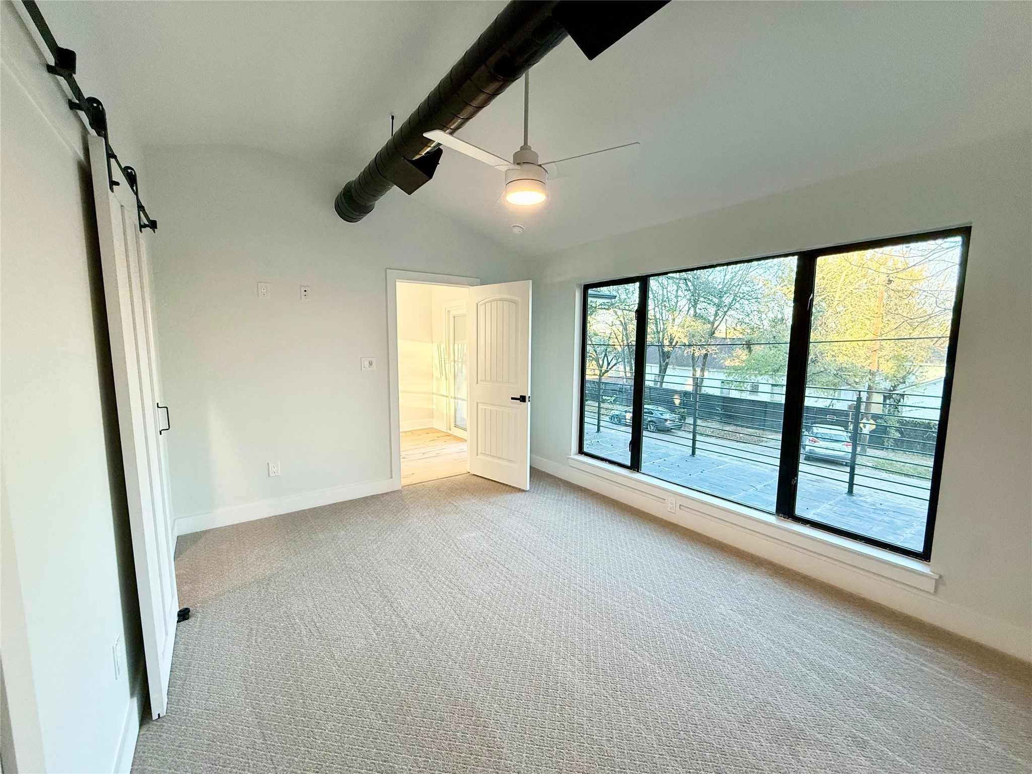 1617 Common Street Houston, TX 77009 - Photo 31 of 50 an empty room with windows and city view