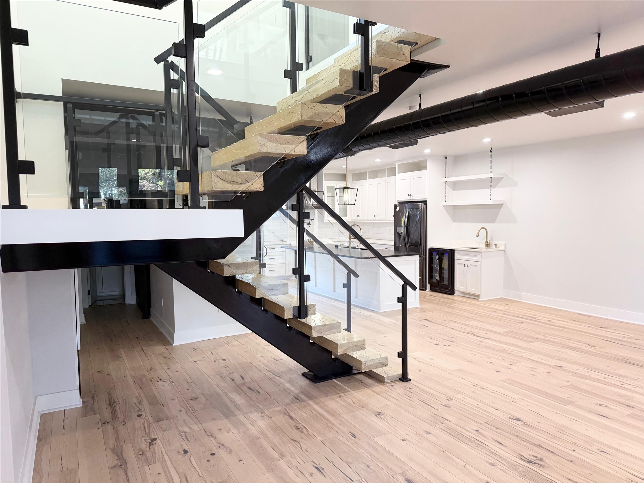 1617 Common Street Houston, TX 77009 - Photo 4 of 50 a view of entryway and hall with wooden floor