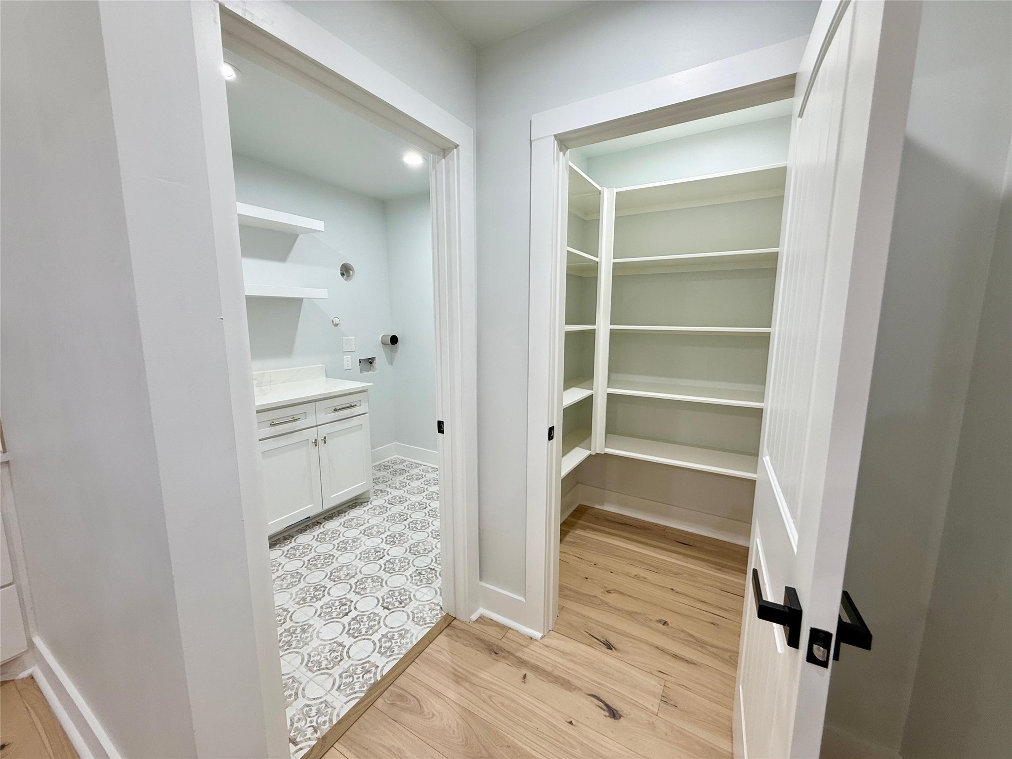 1617 Common Street Houston, TX 77009 - Photo 45 of 50 a room with a walk in closet and wooden floor