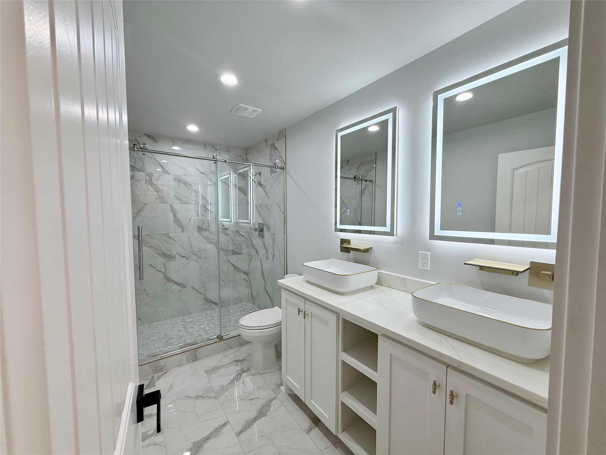 1617 Common Street Houston, TX 77009 - Photo 47 of 50 a bathroom with a sink a toilet and shower